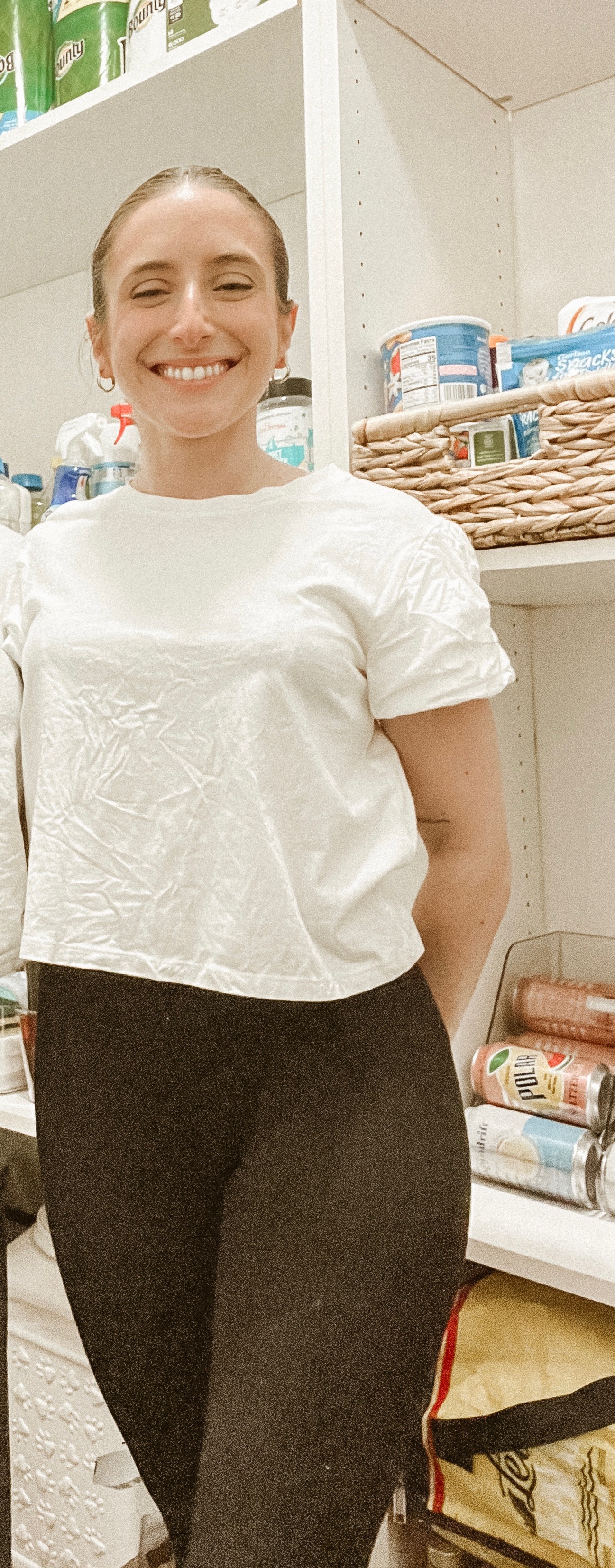 Portrait of the founder of Home Organizers Long Island in a warm, organized home